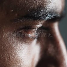 A close-up portrait of a person showing an intense emotional reaction.