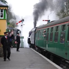 A train leaving a railway station.