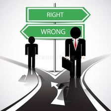 A person facing a sign indicating a wrong choice