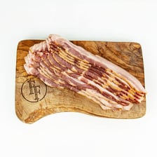 Strips of streaky bacon showing alternating meat and fat