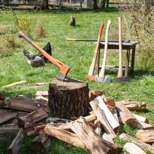 A woodcutting axe resting on a log
