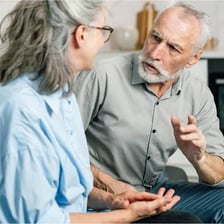 Two people in conversation, with one appearing to deceive the other