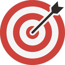 An archery target with arrows near the bullseye.