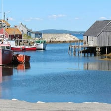 A boat moored beside a dock in a harbour