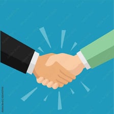 Two people shaking hands to show agreement