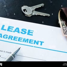 Keys and a lease document representing a rented apartment