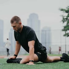 An athlete stretching before taking part in exercise