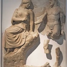 A visual pairing of a statue of Zeus and an Olympic athlete.