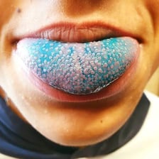 A person tasting food to assess its flavour.