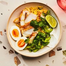 A serving of kedgeree with rice, smoked fish and boiled eggs