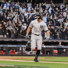 New York Yankees players on a baseball field.