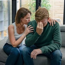 A person visibly expressing severe emotional distress