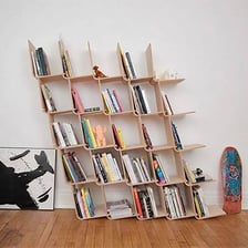 A visibly crooked bookshelf leaning to one side.