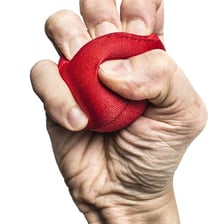 A hand holding an object in a tight grip