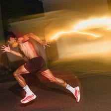 A person running quickly with motion blur.