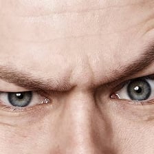A close-up view of a human eyebrow above the eye.