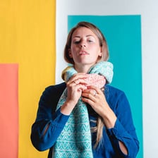 A scarf worn around a person’s neck as a muffler.