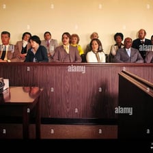A group of jurors seated in a courtroom.