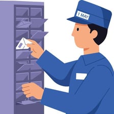 A postal worker sorting letters at a post office.