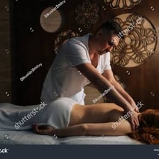A professional masseur giving a massage.