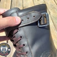 A leather strap used to fasten an object.