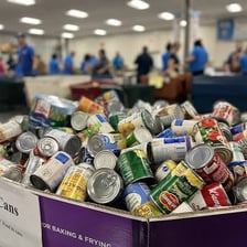 A canned food donation at a food bank.