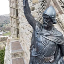 A statue or monument depicting William Wallace in Scotland.