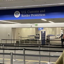 An airport customs and border-control inspection area.