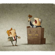 A courtroom judge reacting with visible shock from the bench