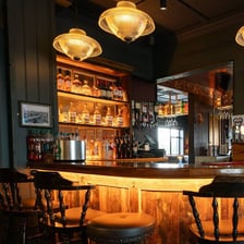 The interior of a pub bar, with the room closed and empty.