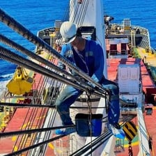 A qualified sailor working aboard a ship at sea