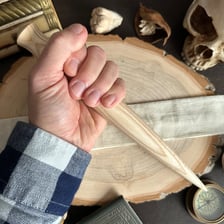 A pale, ashen wooden stake illustrating the verb “impale”