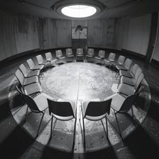 A clandestine group meeting in an underground room.
