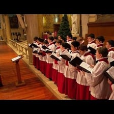 A Roman Catholic choir singing inside a church.