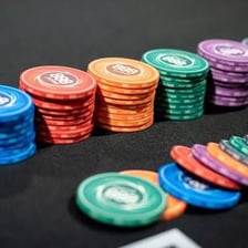 Poker chips placed in the centre of a table as an ante.