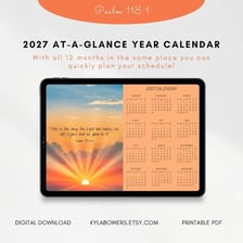 A calendar beside a sunrise, suggesting an early time in the year or day.