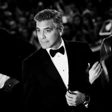 An elegantly dressed person presenting a polished, sophisticated appearance