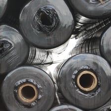 Rolls of textile fabric used as a construction or furnishing material.