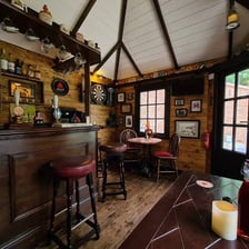 The interior of a traditional English pub bar.