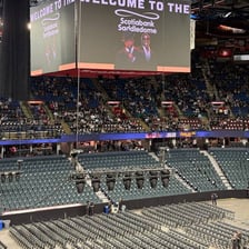 An audience waiting for a delayed live music performance.