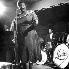 Ella Fitzgerald performing swing jazz on stage