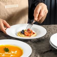A plate designed for serving soup.