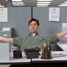 A visually dull office scene with an unenthusiastic worker