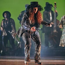 A tap dancer wearing specialist tap shoes while performing on stage.