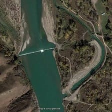 A river weir viewed from above.