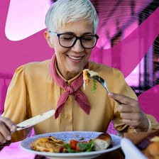 A person eating a meal at a table.