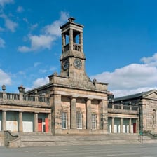A traditional British school building with formal architecture.