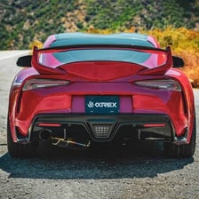The illuminated red taillight on the rear of a car.