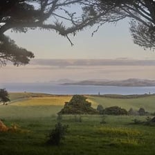 A landscape illuminated by early morning dawn light.