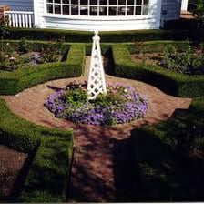 A garden area planted with shrubs beside a path